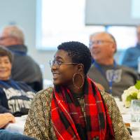 woman listening to speaker